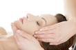 Photo: Woman enjoy receiving face massage Woman enjoy receiving face massage