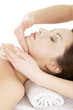 Woman enjoy receiving face massage