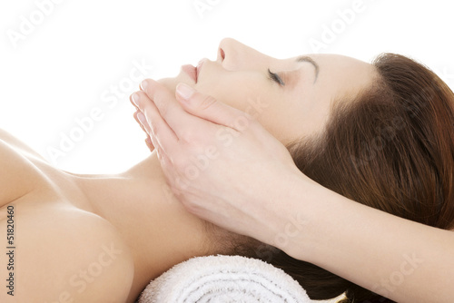 Photo: Woman enjoy receiving face massage Woman enjoy receiving face massage