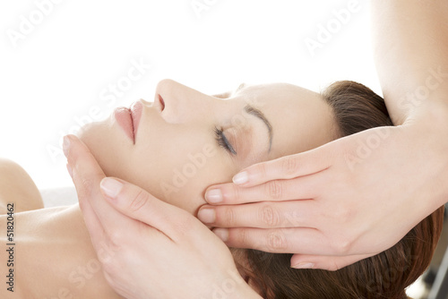 Photo: Woman enjoy receiving face massage Woman enjoy receiving face massage