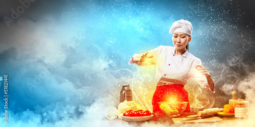 Photo: Asian female cooking with magic Asian female cooking with magic