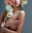 fashion model with large hairstyle and flowers in her hair.