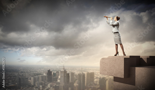 Photo: Business woman with telescope Business woman with telescope