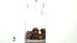 Eurocents falling in a glass