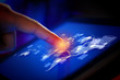 Closeup of finger touching tablet-pc screen