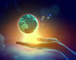 Image of earth planet on hand