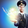 Image of pilot with plane in hand