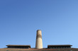 Photo: Chimney and roof in an old industrial plant Chimney and roof in an old industrial plant