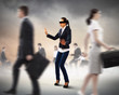 Businesswoman in blindfold among group of people