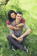 Couple Relaxing on Green grass
