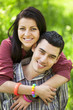 Photo: Couple Relaxing on Green grass Couple Relaxing on Green grass