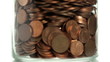 Eurocents falling in a glass
