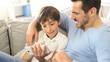 Little boy with dad playing with smartphone