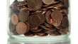 Eurocents falling in a glass