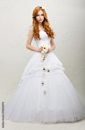 Photo: Redhaired Bride in White Bridal Dress. Wedding Fashion Redhaired Bride in White Bridal Dress. Wedding Fashion