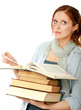 Photo: A college girl holding a pile of books A college girl holding a pile of books