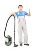 Full length portrait of a male cleaner with a vacuum cleaner giv