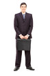 Full length portrait of a young businessman with a briefcase pos