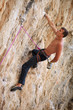 Rock climber on a face of a cliff