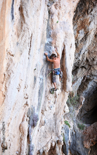 Photo: Rock climber on a cliff Rock climber on a cliff