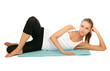 A sportive young woman lying on the floor