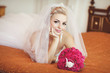 Beautiful bride in wedding dress with bouquet bridal flowers
