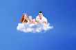 family resting on a cloud