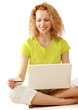 Photo: Happy woman sitting on floor and shopping Happy woman sitting on floor and shopping
