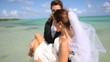 Just married couple having fun at the beach