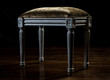 Vintage hassock with velvet upholstery and carved legs