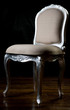 Vintage beige color chair with carved legs