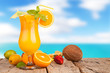Fresh summer drink on wooden table with blur sea background
