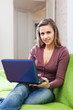  woman  with netbook on sofa