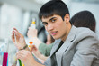 High School students. Handsome mixed race guy working at laborat