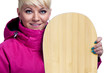 Cheerful young woman with snowboard