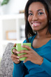 African woman enjoying in coffee