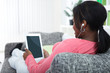 Photo: Woman relaxing with tablet Woman relaxing with tablet