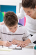 sister and  brother doing  homework together