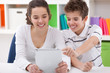Foto: Happy children with tablet pc Happy children with tablet pc