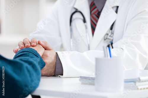 Photo: doctor comforting patient doctor comforting patient