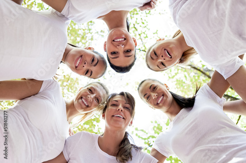 Photo: Women with heads together Women with heads together