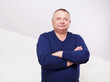 Photo: Portrait of senior man in jumper over white Portrait of senior man in jumper over white