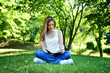 Woman reading book in the park