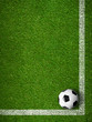 Soccer ball framed by white marking lines top view. Sport backgr