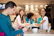 Group of girl watching handsome man in cafe