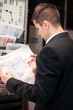 Businessman reading newspaper