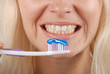 Woman brushing her teeth