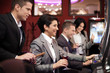 Photo: Young people gambling on slot machines Young people gambling on slot machines