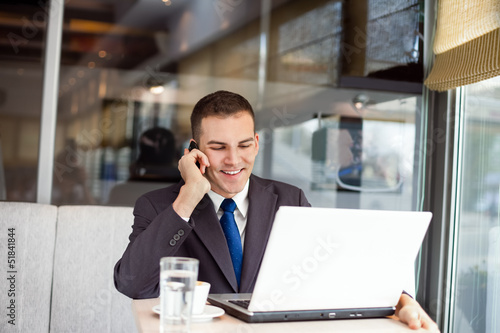 Photo: Businessman working in cafe Businessman working in cafe