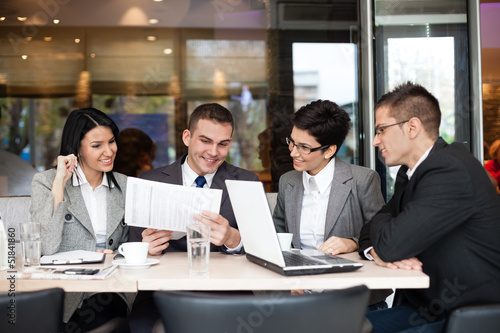Photo: Business team having a business meeting Business team having a business meeting